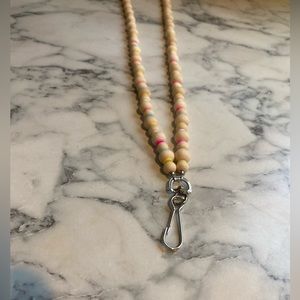 All natural wooden beads and clay. Badge holder.